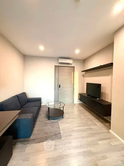 Modern living room with sleek furniture and stylish decor in a contemporary apartment.