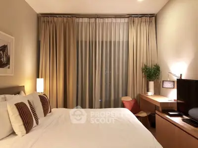 Elegant bedroom with modern decor, featuring a cozy bed, stylish desk, and ambient lighting for a serene atmosphere.