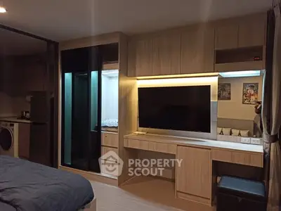 Modern studio apartment with sleek built-in furniture and cozy ambiance