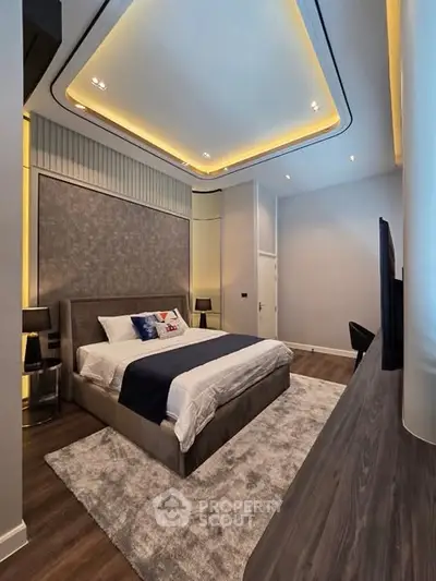 Luxurious modern bedroom with elegant lighting and plush decor