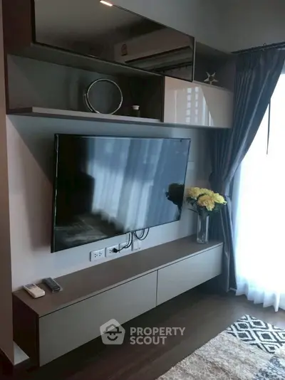 Modern living room with sleek TV setup and elegant decor