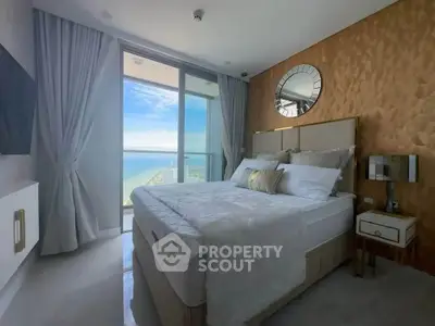 Luxurious bedroom with ocean view and elegant decor in high-rise apartment