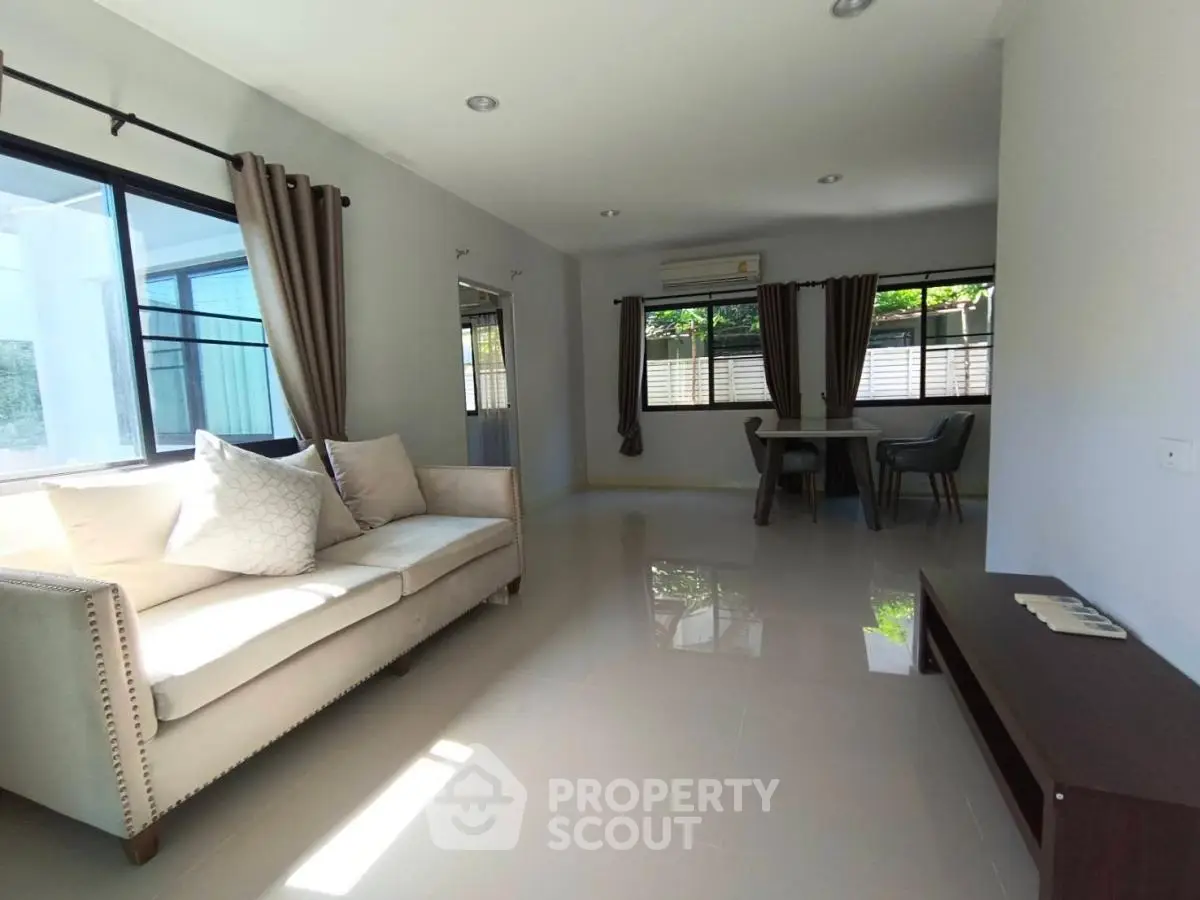 Spacious living room with modern decor and natural light