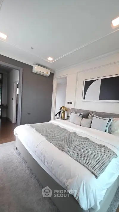 Luxurious modern bedroom with stylish decor and cozy ambiance, perfect for relaxation and comfort.