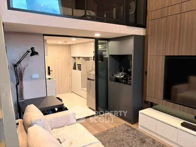 Modern living room with open kitchen in stylish apartment
