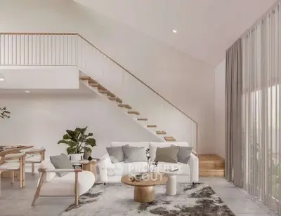 Modern living room with stylish furniture and open staircase, featuring large windows and natural light.