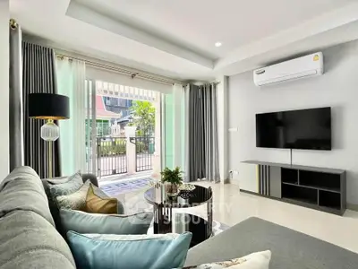 Modern living room with stylish decor and large window view