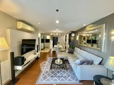 Spacious modern living room with elegant decor and open layout, featuring a large sectional sofa and stylish dining area.