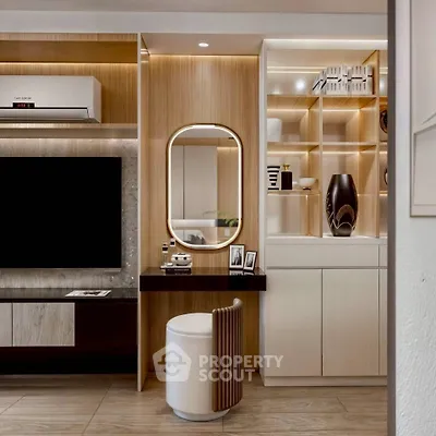 Modern living room with stylish decor, built-in shelves, and elegant lighting.
