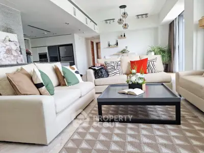 Spacious modern living room with stylish decor and open kitchen layout
