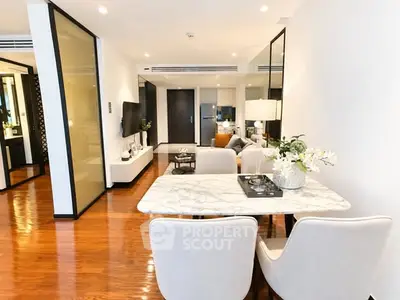 Luxurious open-plan living and dining area with elegant decor and modern furnishings.