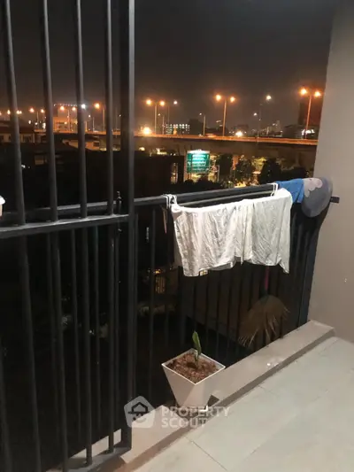 Cozy balcony with city view, perfect for relaxing evenings.