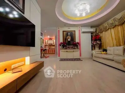 Spacious living room with elegant decor and modern lighting