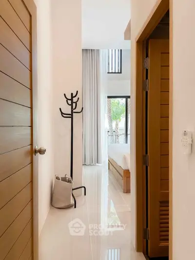 Modern bedroom entrance with sleek design and natural light