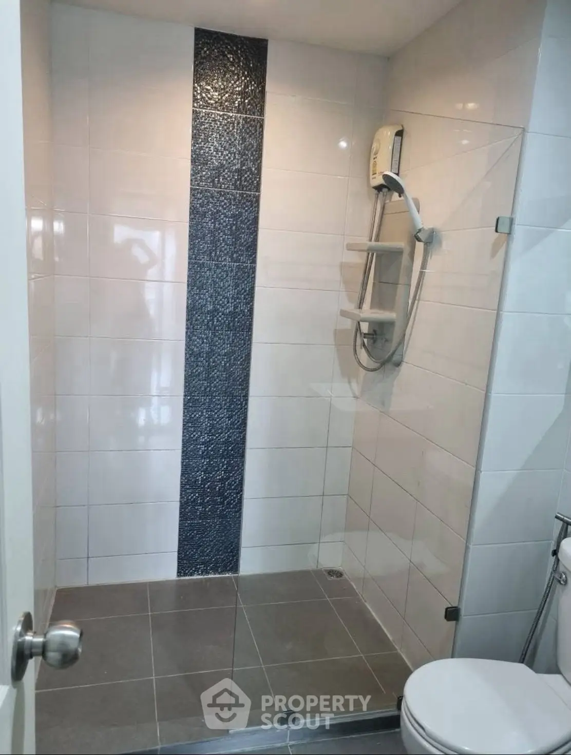 Modern bathroom with glass shower and sleek tile design