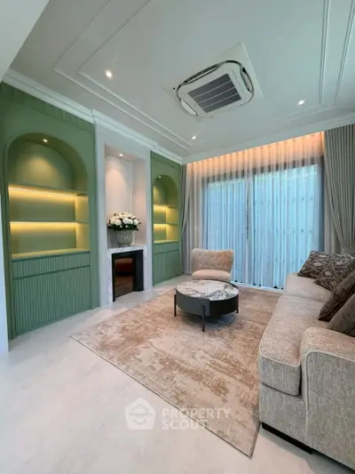 Elegant living room with modern decor, featuring a cozy sofa, stylish coffee table, and built-in shelves with ambient lighting.