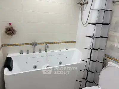 Modern bathroom with sleek bathtub and stylish shower curtain