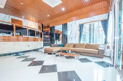 Luxurious modern living room with stylish decor and spacious seating area.
