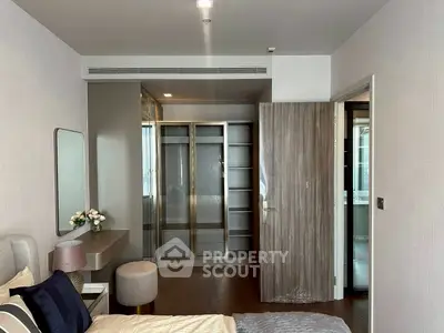 Modern bedroom with walk-in closet and elegant decor