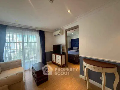 Charming living room with elegant decor and natural light, featuring a cozy sofa and stylish furniture.