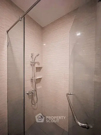Modern bathroom with sleek shower design and glass partition