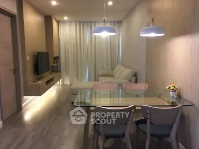 Modern living room with cozy sofa and elegant dining area