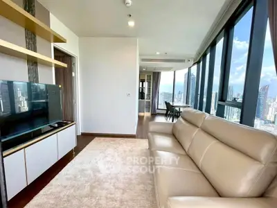 Luxurious high-rise living room with stunning city views and modern furnishings.