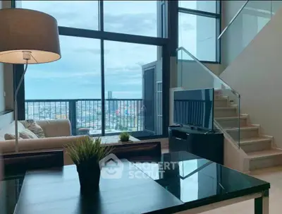 Luxurious modern living room with stunning city view and elegant staircase