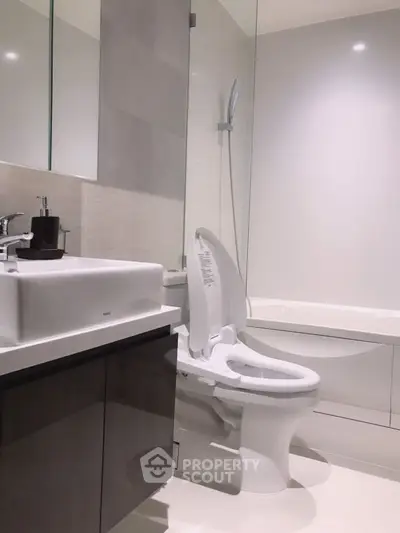 Modern bathroom with sleek fixtures and a luxurious bathtub.