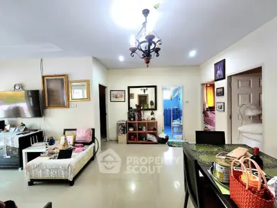 Spacious living room with elegant chandelier and modern decor