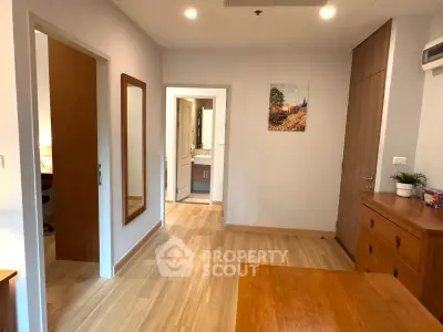 Spacious bedroom with wooden flooring and modern decor