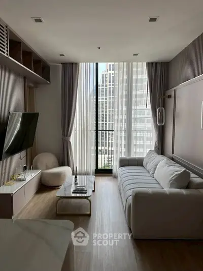 Modern living room with floor-to-ceiling windows and stylish decor