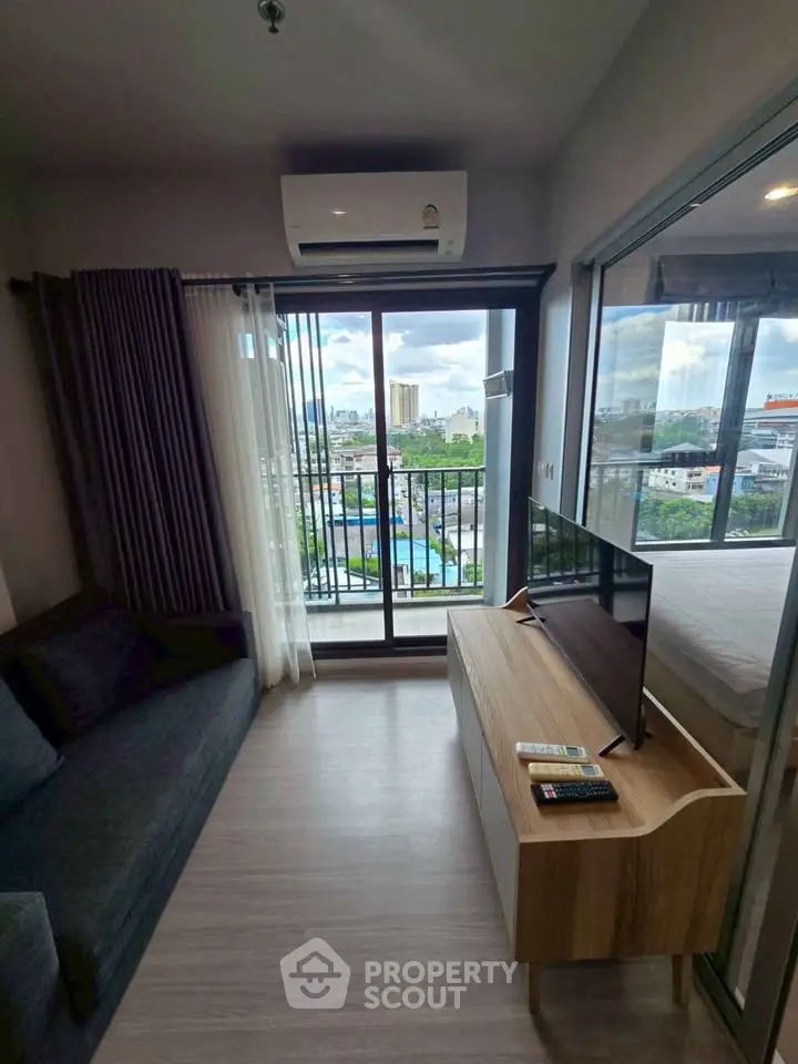 Modern living room with balcony view in urban apartment