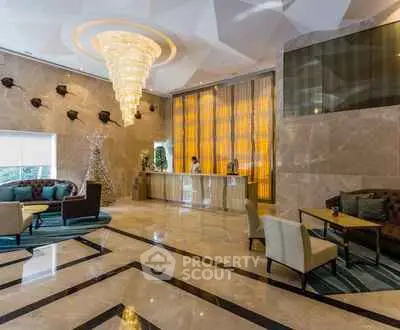 Luxurious hotel lobby with elegant chandelier and modern decor