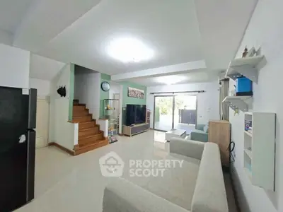 Spacious modern living room with sleek design and natural light