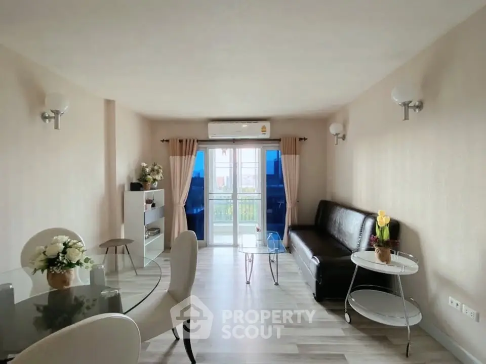 Spacious living room with modern decor and natural light