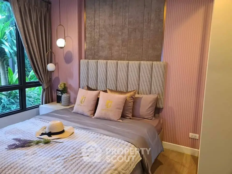 Charming bedroom with elegant decor and large window view