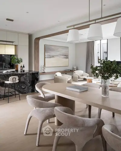 Luxurious open-plan living and dining area with modern decor and elegant furnishings.