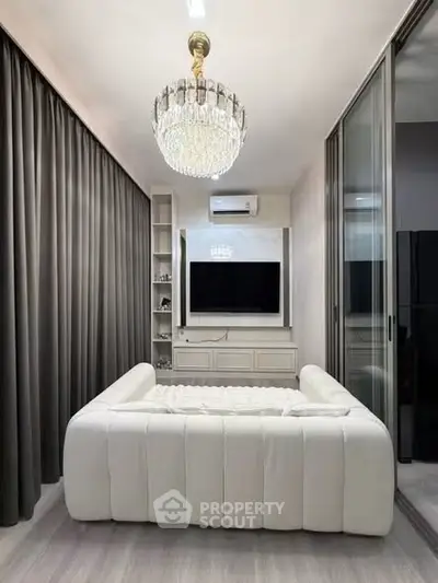 Luxurious living room with elegant chandelier and modern decor