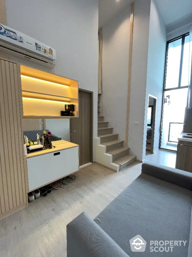 Modern loft-style living room with high ceilings and sleek design