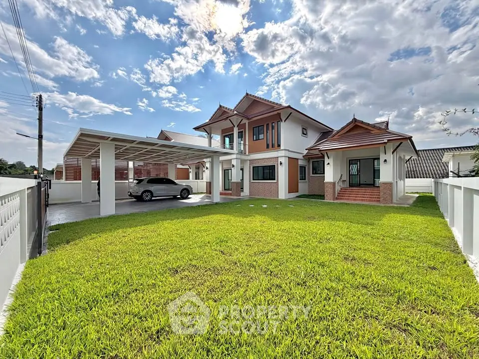 Stunning two-story house with spacious lawn and carport, perfect for family living in a serene neighborhood.