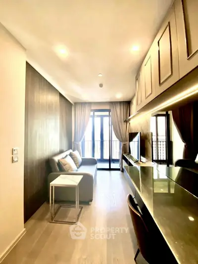 Modern living room with sleek design and balcony access, featuring stylish furniture and ambient lighting.