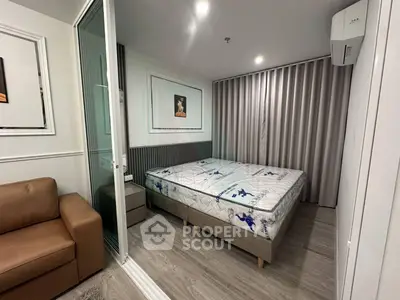 Modern bedroom with stylish decor and comfortable bed in a contemporary apartment.
