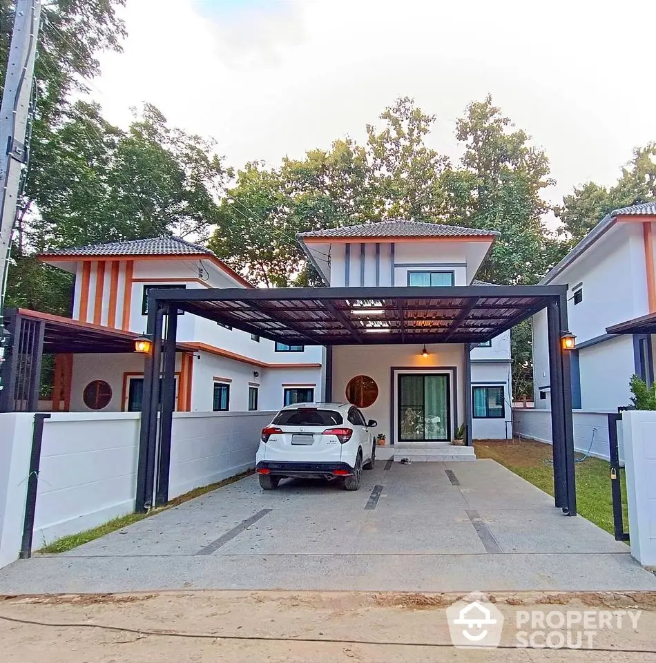 Modern two-story house with carport and driveway in suburban setting