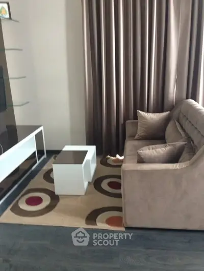 Cozy living room with modern sofa and stylish decor in a contemporary apartment.
