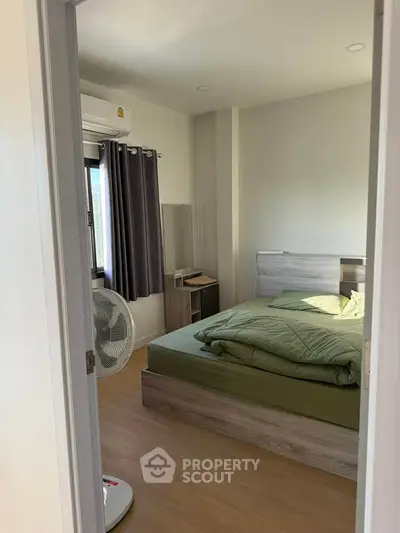 Cozy bedroom with modern decor and natural light