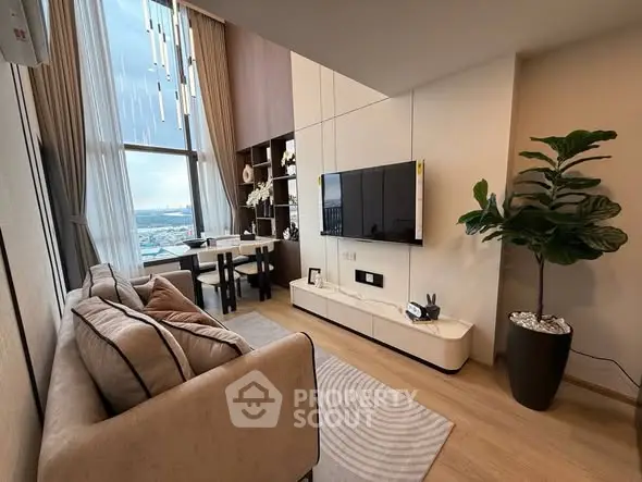 Modern living room with large window and stylish decor