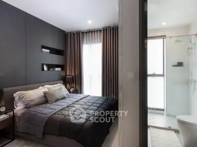 Modern bedroom with ensuite bathroom, featuring sleek design and ample natural light.
