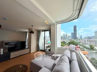 Spacious living room with panoramic city view and modern decor