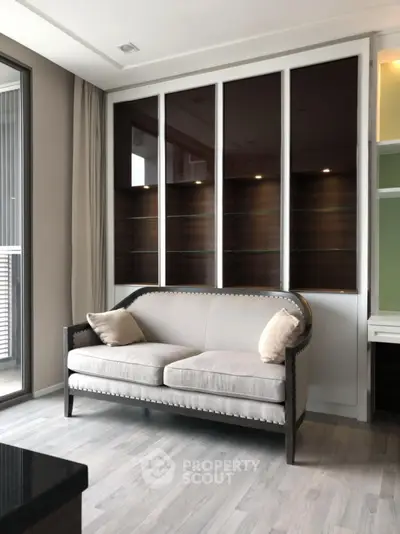 Modern living room with elegant sofa and large windows